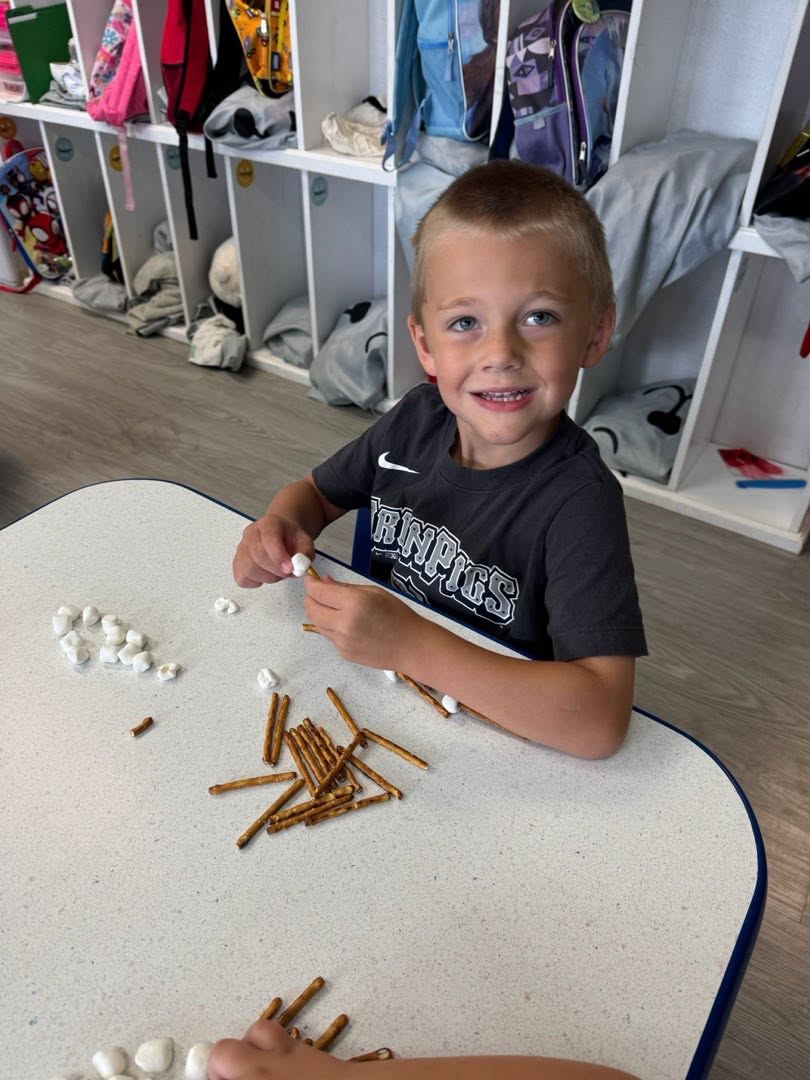 Children learning together through hands-on play and discovery at River of Life Daycare