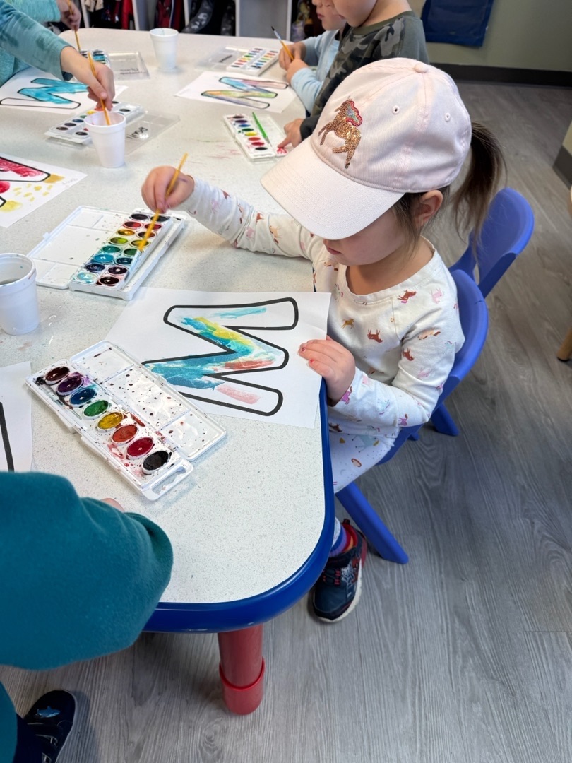 Two-year-old doing watercolor art activity